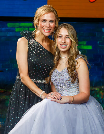 Joyful bat mitzvah girl and her mother smiling together at Beat Street Huntingdon Valley, PA