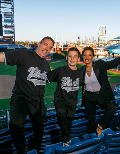 Getting ready for the big celebration in the stadium Bar Mitzvah boy and his dad in custom black Philly baseball jerseys and mom at Citizens Bank Park