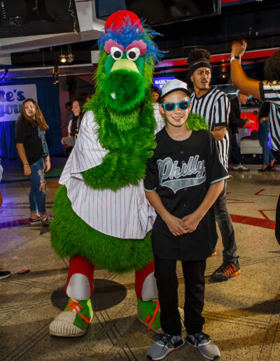 PCSI Photo captures this playful photo with the Bar Mitzvah boy getting a hug from the Philly Fanatic at Citizens Bank Park