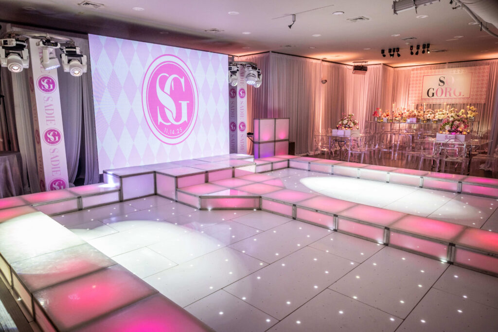 pink and white bat mitzvah stage for fashion theme bat mitzvah at platform thirty at beat street station in philadelphia